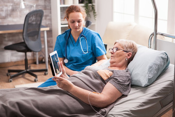 nurse and woman in nursing home